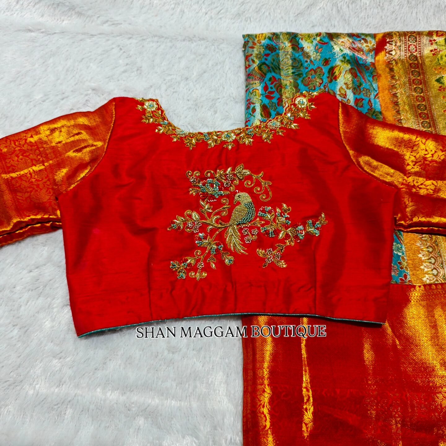 Red bridal maggam work blouse with heavy embroidery, stone and zardosi design by Shan Maggam Boutique Visakhapatnam